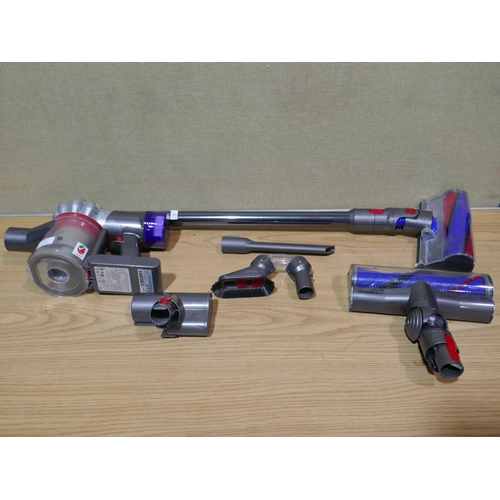 6117 - Dyson V8 Stick Vacuum Cleaner with accessories, no box, original RRP £264.99 *This lot is subject to... 