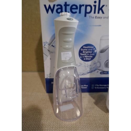 6016 - Waterpik Water Flosser with box and accessories   *This lot is subject to Vat