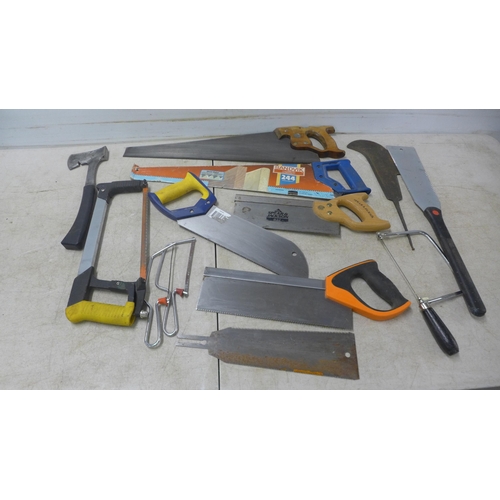 5022F - A quantity of assorted hand saws including Sandvik, an axe and hedge knife