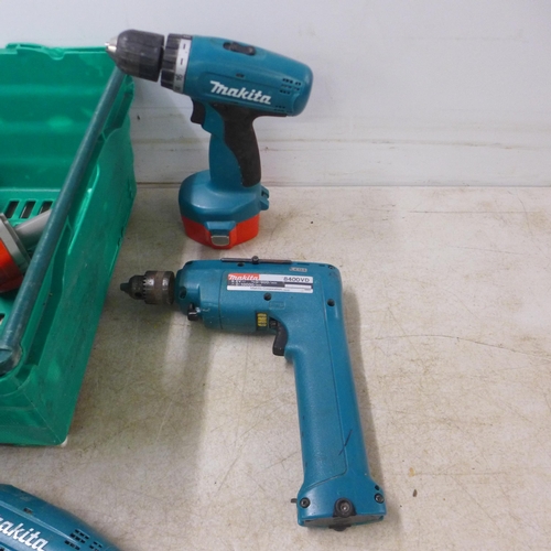 5040 - A quantity of Makita power tools including 5 drills 8390D, 6280D, 2 x 8480D, a quantity of batteries... 