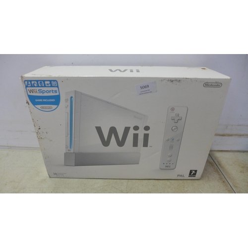 5069 - A boxed Nintendo Wii console with stand, sensor bar and AV component cables (missing power supply an... 