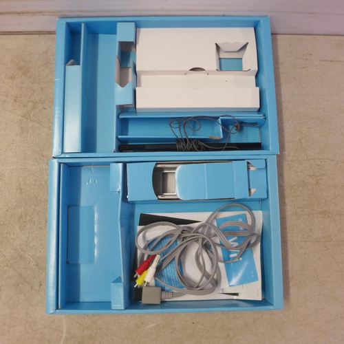 5069 - A boxed Nintendo Wii console with stand, sensor bar and AV component cables (missing power supply an... 