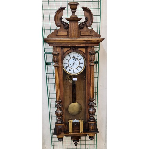 263 - A 19th Century carved walnut double weight 8-day Vienna wall clock