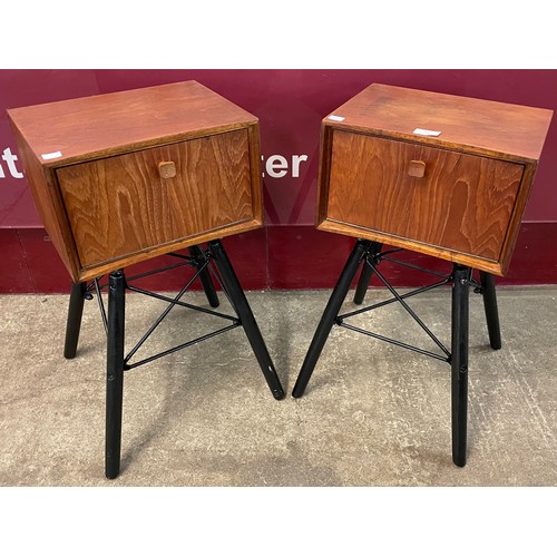 11 - A pair of teak and black tubular metal bedside tables