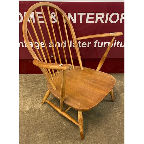 15 - An Ercol Blonde elm and beech 305 model lounge chair