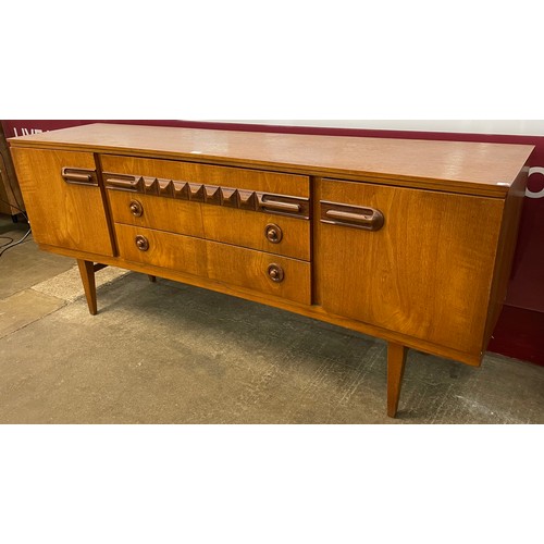 17 - A Beautility teak concave sideboard