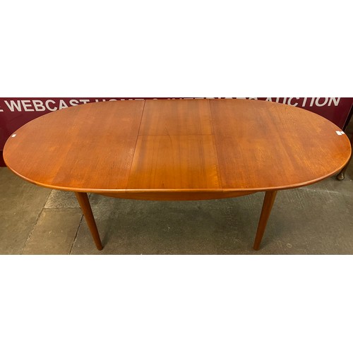 27 - A Jentique teak oval extending dining table