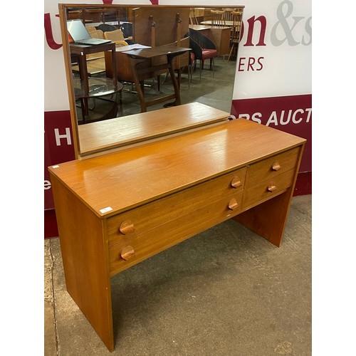 33 - A Stag Cantata teak dressing table, designed by John & Sylvia Reid and a teak stool