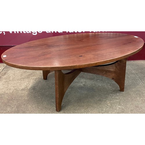 39 - A teak oval coffee table