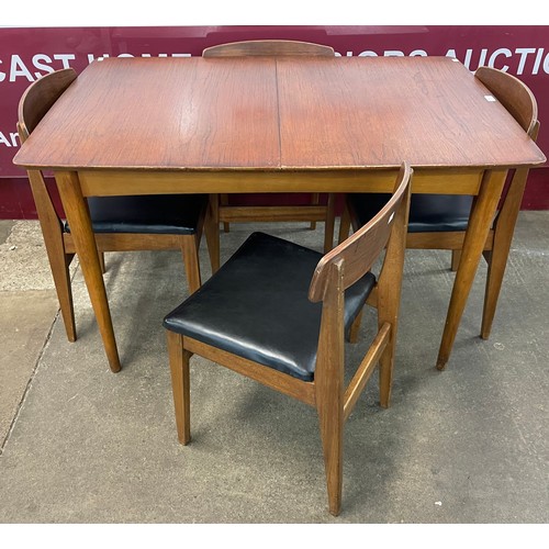 40 - A teak rectangular extending dining table and four chairs