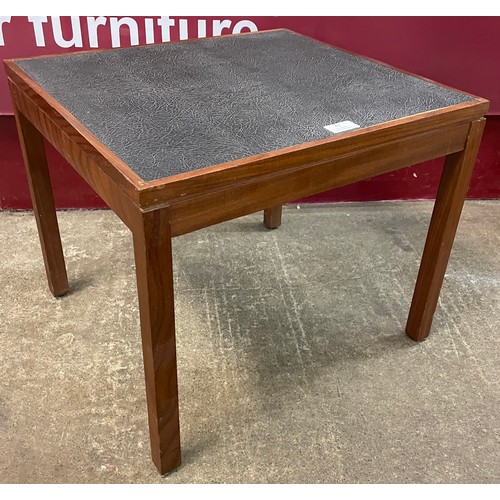 49 - A teak and vinyl side table