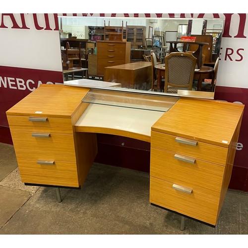 58 - A Stag Fineline teak concave dressing table, designed by John and Sylivia Reid