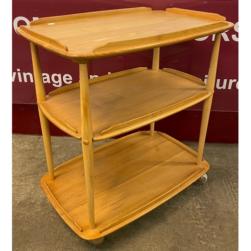 68 - An Ercol Blonde elm and beech Windsor trolley