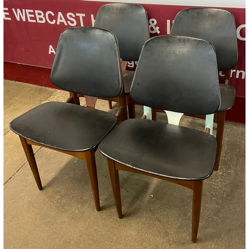 75 - A set of four Elliotts of Newbury teak and black vinyl dining chairs