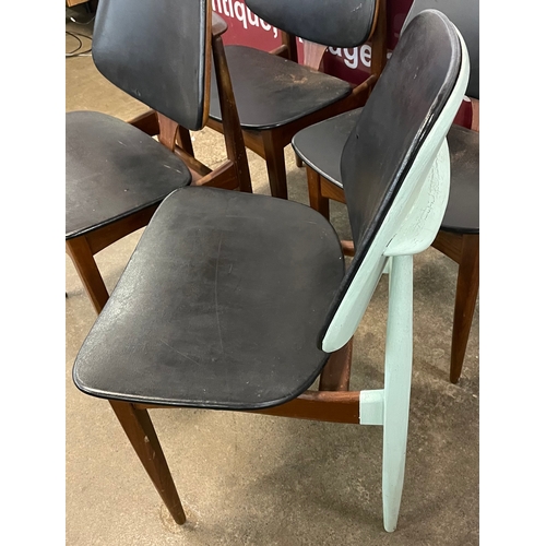 75 - A set of four Elliotts of Newbury teak and black vinyl dining chairs