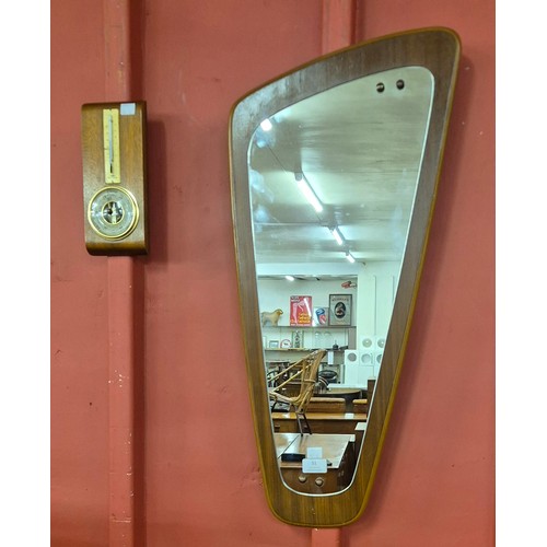 51 - A teak asymmetrical framed mirror and a teak barometer