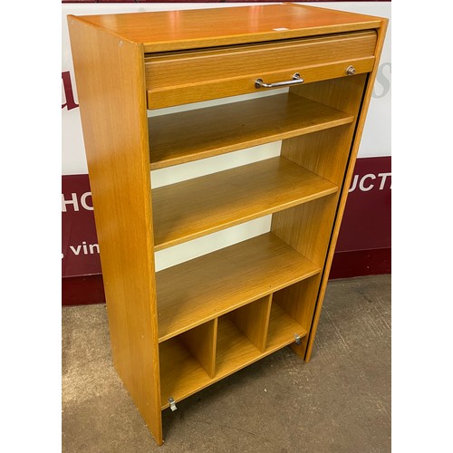 80 - An oak tambour fronted cabinet