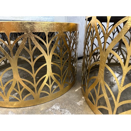 3005 - A pair of gilt leaf circular coffee tables with mirrored tops