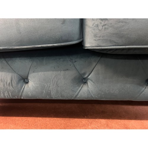 3022 - A turquoise velvet upholstered Chesterfield two seater sofa with patterned scatter cushions on turne... 