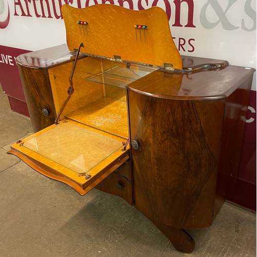 97 - A figured walnut cocktail cabinet