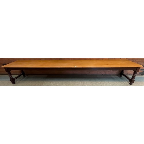 110 - An extremely large Victorian pine scrub top country house serving table (72 x 430 x 64cms)