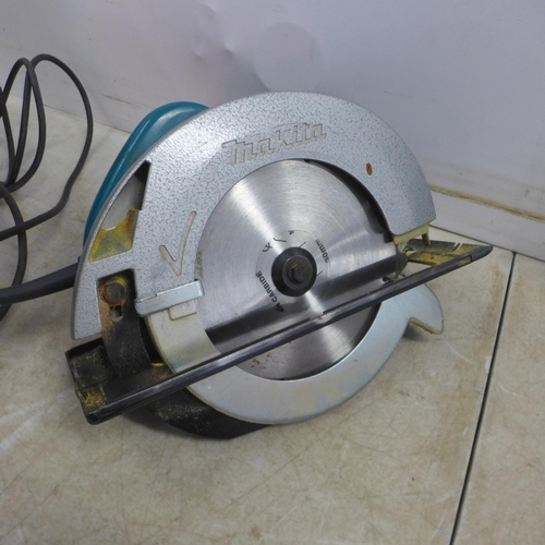 5007 - A Makita 95013, 110V angle grinder in case with a Makita SR2300, 110V 235mm circular saw