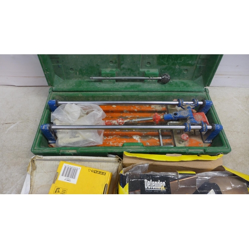 5012 - A Rubi TS-30 tile cutter, Defender E-Lught work light, a pneumatic tacker/nailer and a quantity of D... 