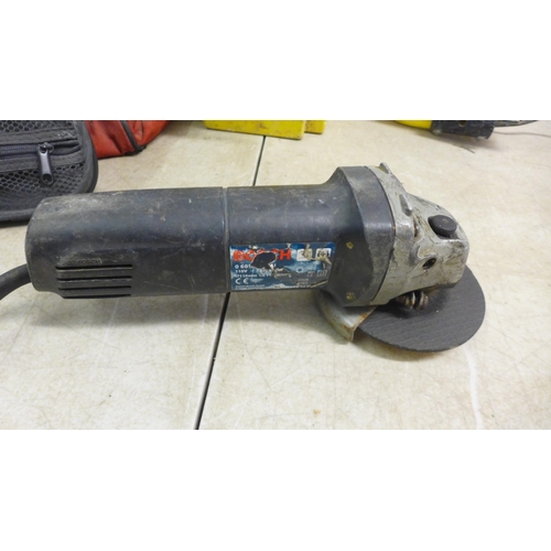 5015 - A Hilti TE5 drill, Bosch angle grinder, a portable halogen work light and a 2 socket 110v transforme... 