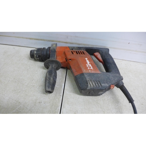 5015 - A Hilti TE5 drill, Bosch angle grinder, a portable halogen work light and a 2 socket 110v transforme... 