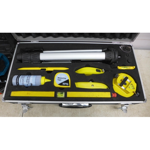 5047 - A Torq laser level kit in case and a mini cordless chainsaw