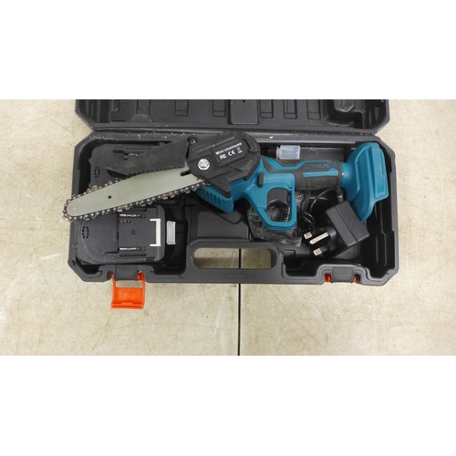 5047 - A Torq laser level kit in case and a mini cordless chainsaw