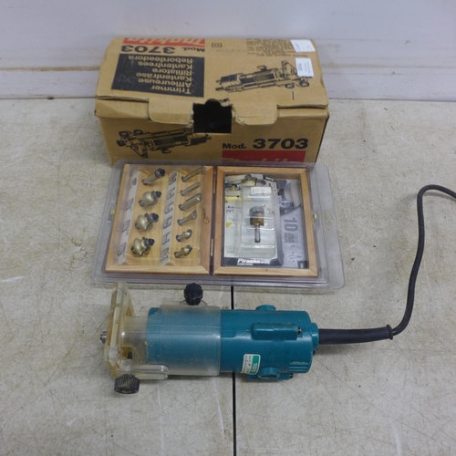 5054 - A Makita 3703 router and a quantity of router bits