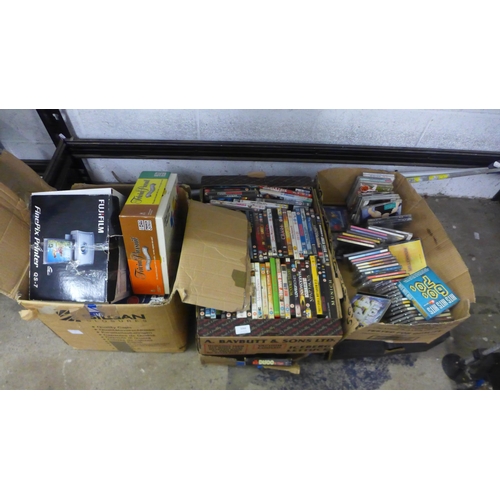 5066 - 5 boxes of various DVDs and CDs, an unused Fuji Film Finepix QS-7 printer and Trivial Pursuit Deluxe... 