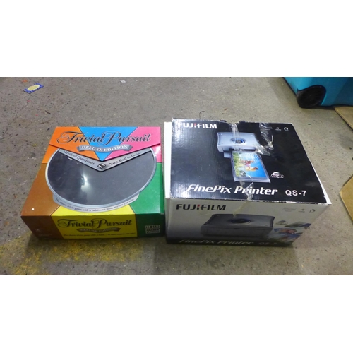 5066 - 5 boxes of various DVDs and CDs, an unused Fuji Film Finepix QS-7 printer and Trivial Pursuit Deluxe... 