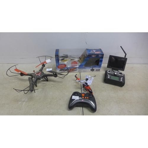 5073 - An X-Rotor Series PIC00-Z remote control helicopter, boxed with remote, a Syma remote control helico... 