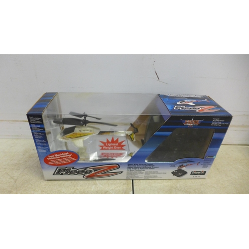 5073 - An X-Rotor Series PIC00-Z remote control helicopter, boxed with remote, a Syma remote control helico... 