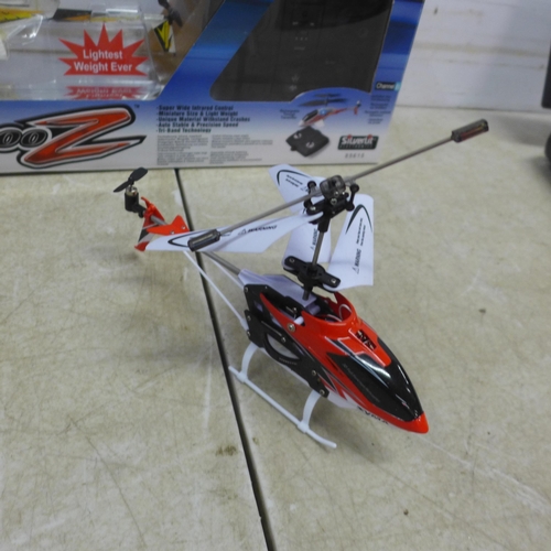 5073 - An X-Rotor Series PIC00-Z remote control helicopter, boxed with remote, a Syma remote control helico... 