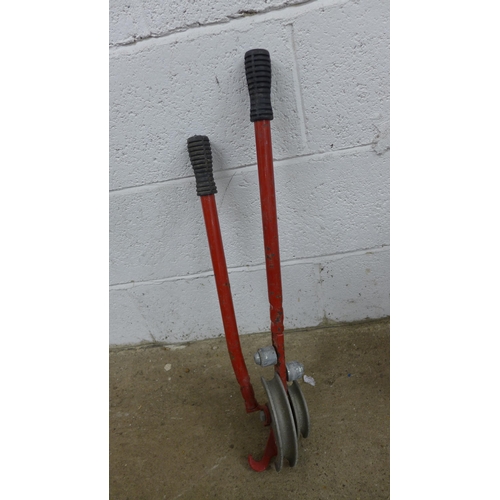 5241 - A quantity of tools including long reach pruners, a pipe bender, a bow saw, shovels, etc.