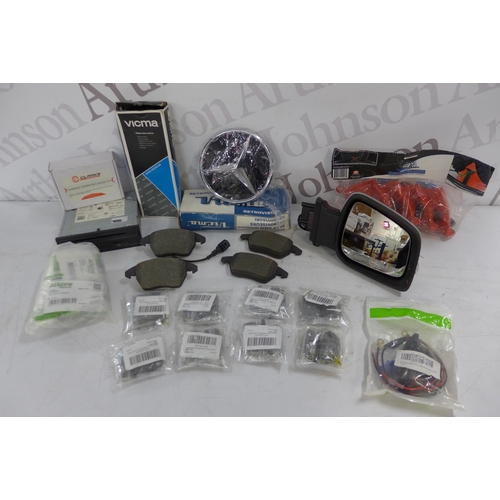 5318 - A box of assorted car accessories including a Mercedes badge, hose guides, wing mirror, car CD playe... 