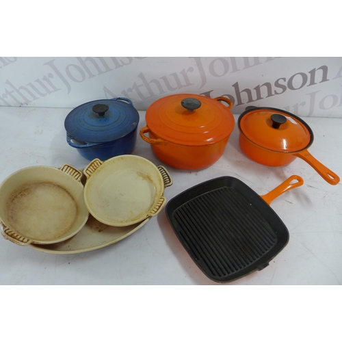 5356 - A quantity of Le Creuset cast iron cookware including a volcanic orange 20cm saucepan, 2 volcanic or... 