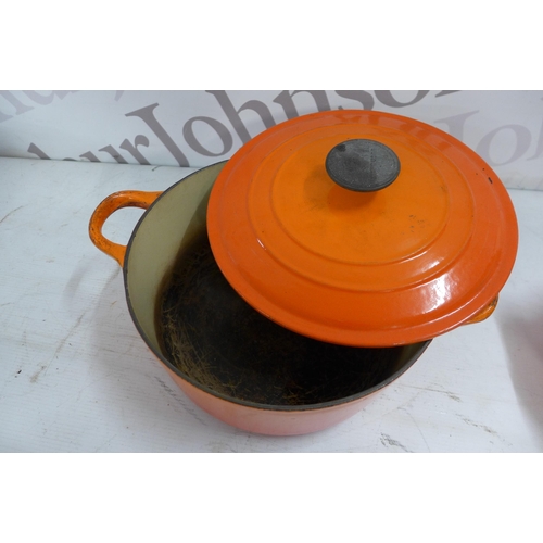 5356 - A quantity of Le Creuset cast iron cookware including a volcanic orange 20cm saucepan, 2 volcanic or... 