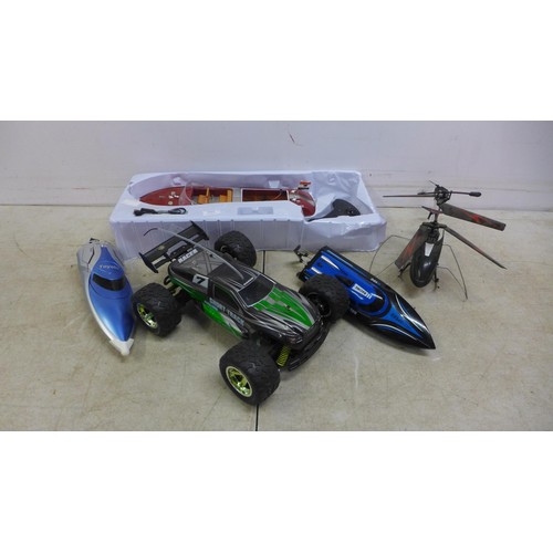 5064 - A collection of assorted remote control vehicles including a H100 Hi-Speed racing boat, a Toyabi T03... 