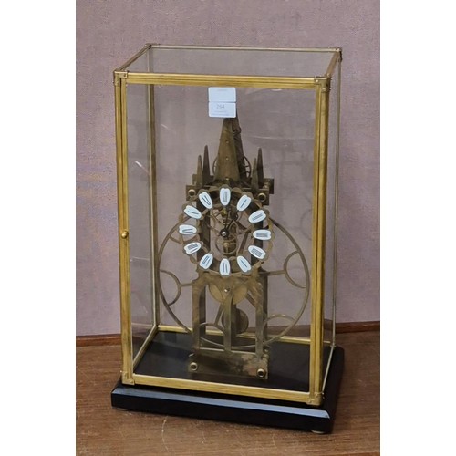 264 - A 19th Century style cased gilt metal skeleton clock