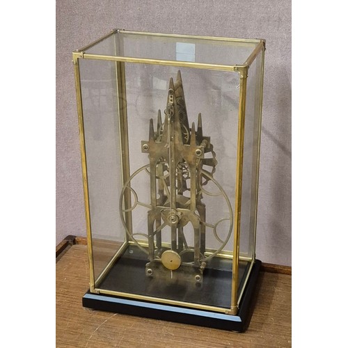 264 - A 19th Century style cased gilt metal skeleton clock