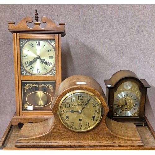 260 - An early 20th Century oak mantel clock, a German Franz Hermle mantel clock and a Highlands wall cloc... 