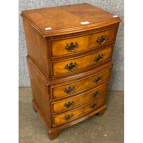 128 - A small George III style walnut chest on chest