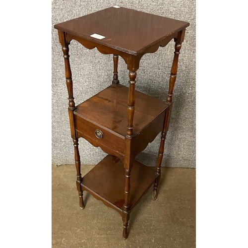 129 - A Victorian mahogany three tier night stand