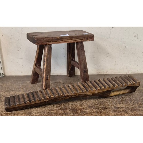 268 - A Victorian style primitive elm stool and an African hardwood washboard