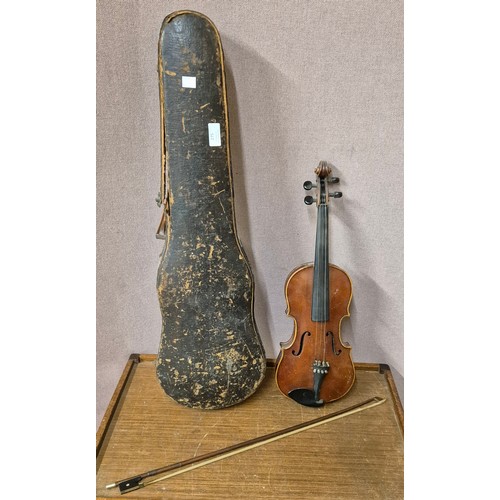 275 - A cased violin (length of back inc. button 35cm) and bow