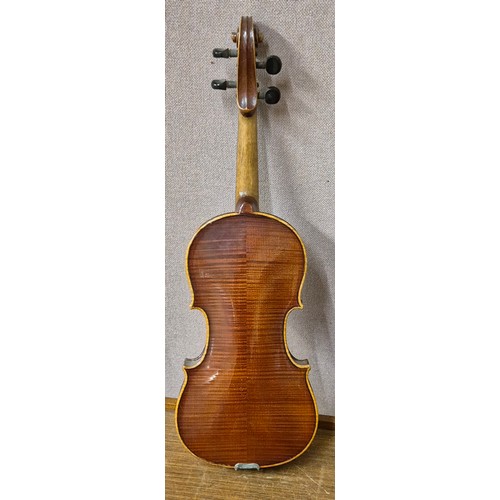 275 - A cased violin (length of back inc. button 35cm) and bow